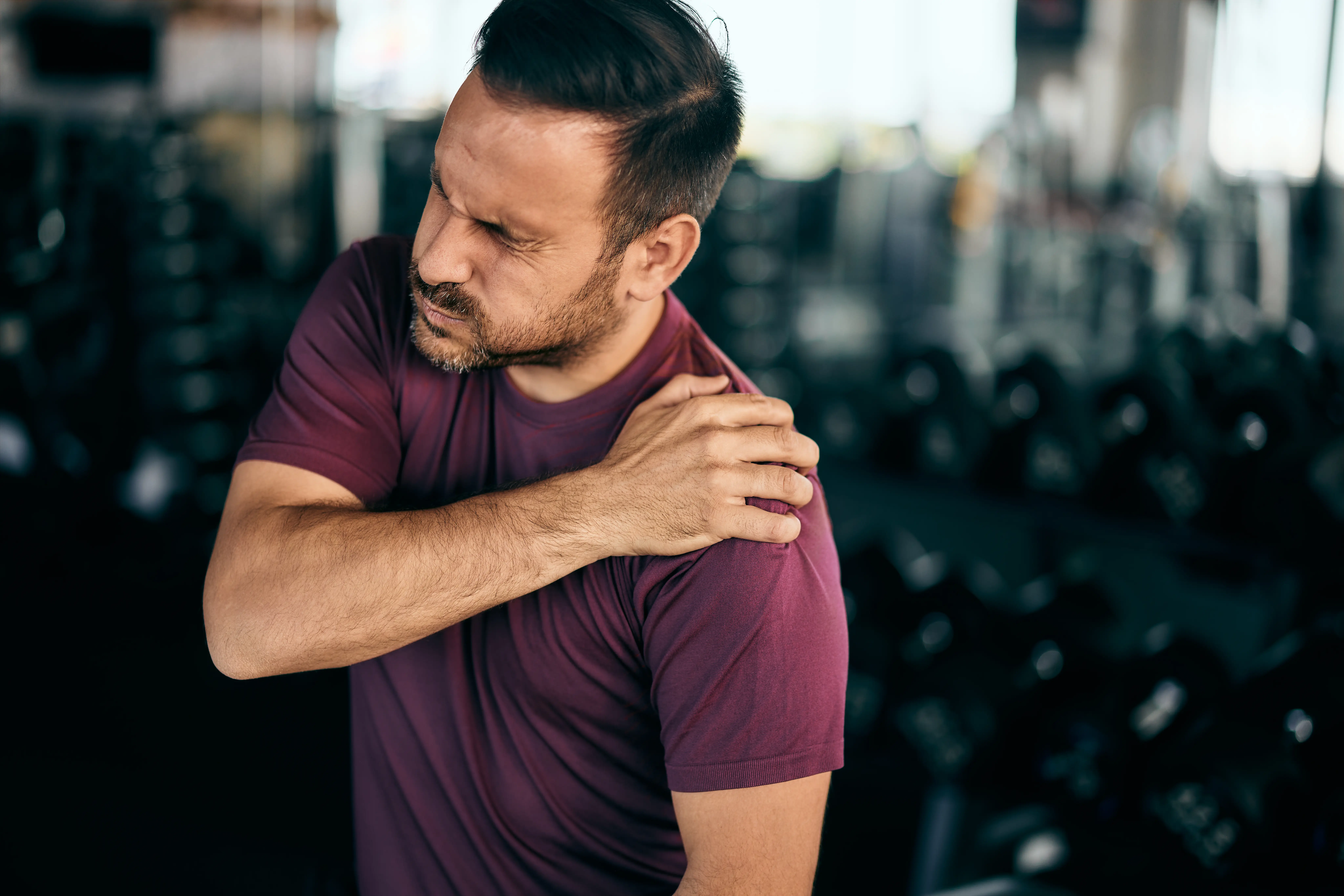 An active man made a shoulder injury at the gym during a workout